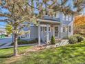 Inviting front porch with a cozy entry and tidy landscaping at 140 Sugar Plum Way, Castle Rock, CO 80104