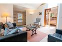 Cozy living room featuring a comfortable seating arrangement, a skylight, and stylish decor at 1878 S Gilpin St, Denver, CO 80210