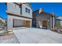 Spacious three-car garage with an extra space and a well-lit driveway at 1715 Pioneer Cir, Lafayette, CO 80026