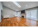 Spacious living room with hardwood floors and fireplace at 2761 S Xanadu Way, Aurora, CO 80014