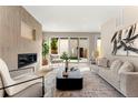 Cozy living room with a modern fireplace, stylish decor, and sliding doors to outdoor space at 4570 N Raleigh St, Denver, CO 80212