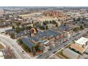 Aerial view of the complex featuring a swimming pool and a common green space at 3009 Madison Ave # K317, Boulder, CO 80303