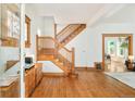 Welcoming foyer with hardwood floors and a beautiful staircase at 2228 N Race St, Denver, CO 80205