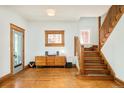 Foyer features hardwood floors, staircase and vintage window details at 2228 N Race St, Denver, CO 80205