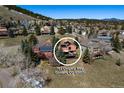 Scenic aerial view of the property showcasing its location in a mountain neighborhood at 783 Calgary Way, Golden, CO 80401