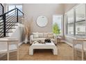 Spacious living room with large windows, and comfortable seating area at 147 Chapel Hill Cir, Brighton, CO 80601