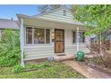 Charming home with a cozy front porch, secure screen door, and a well-maintained walkway leading to the entrance at 6260 W 45Th Pl, Wheat Ridge, CO 80033