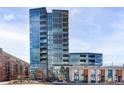 Modern high-rise exterior showcasing sleek glass facade, multiple balconies, and contemporary architectural design at 4200 W 17Th Ave # 419, Denver, CO 80204