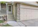 Close-up view of the entrance, showcasing stone accents and a well-maintained front door at 12021 Dahlia Dr, Thornton, CO 80241