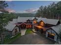 Beautiful home with stone accents, three-car garage, and mountain views at 2929 Highlands View Rd, Evergreen, CO 80439