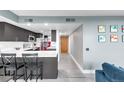 Modern kitchen with stainless steel appliances and a breakfast bar at 5955 E 10Th Ave # 507, Denver, CO 80220