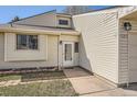 Close up of this home's entry featuring attractive trim, windows and a solid front door at 4272 E 126Th Pl, Thornton, CO 80241