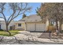 Well-kept home with a two-car garage, lush green lawn, and a neatly paved driveway at 4272 E 126Th Pl, Thornton, CO 80241