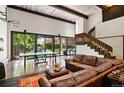 Spacious recreation room featuring large windows, a ping pong table, and comfortable leather seating at 50 Albion St, Denver, CO 80220