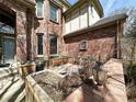 Backyard area with brick wall, garden bed, and a classic lantern at 8461 Pawnee Ln, Niwot, CO 80503