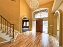 Elegant foyer with hardwood floors, a chandelier, and curved entryways at 8461 Pawnee Ln, Niwot, CO 80503