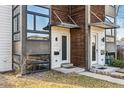 Up-close view of the duplex entrances featuring modern design and well-kept landscaping at 4129 Zenobia St, Denver, CO 80212