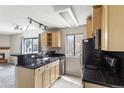 Well-lit kitchen with granite counters and stainless steel sink at 6380 S Boston St # 397, Greenwood Village, CO 80111