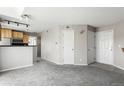 Open-concept living area with neutral paint and carpet flooring at 6380 S Boston St # 397, Greenwood Village, CO 80111