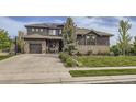 Charming two-story home featuring a well-manicured lawn and stone accents at 1495 W 137Th Ave, Broomfield, CO 80023
