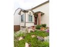 Charming home exterior with a beautiful garden and inviting entrance at 10218 Woodrose Ct, Highlands Ranch, CO 80129