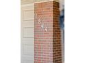 Close up of the house number, 1844, displayed on a brick column near the garage at 1844 S Pontiac Way, Denver, CO 80224