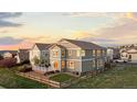 Well-maintained exterior featuring a large deck, fenced yard, and professional landscaping at 1983 Candleglow St, Castle Rock, CO 80109