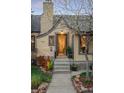 Inviting home entrance with brick facade, manicured landscaping, and a well-lit doorway at 510 16Th St, Golden, CO 80401