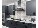 The kitchen showcases modern appliances, sleek countertops, and stylish gray cabinetry at 1401 Delgany St # 203, Denver, CO 80202