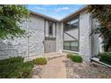 Inviting entrance with stone facade, unique architecture, and a well-maintained walkway at 5751 E Ithaca Pl # 3, Denver, CO 80237