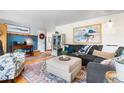 Well-decorated living room with vintage charm and a view to a hallway and seating area at 7034 S Cherry St, Centennial, CO 80122