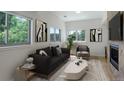 Living room with fireplace and large windows at 500 30Th St # 3, Denver, CO 80205