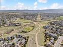 Expansive aerial view showcasing the neighborhood, local parks, and community layout at 684 Poppy Pl, Highlands Ranch, CO 80129