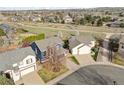 Beautiful aerial view of the home and its surrounding neighborhood, showcasing green spaces at 684 Poppy Pl, Highlands Ranch, CO 80129
