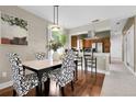 Elegant dining area featuring a marble-topped table, stylish chairs, and hardwood floors at 503 15Th St, Golden, CO 80401