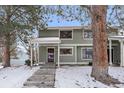 Cozy two-story townhome with snowy front yard and walkway at 8308 W 90Th Ave, Westminster, CO 80021