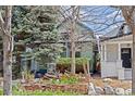 Inviting home exterior with lush garden, mature trees, and beautiful landscaping at 2514 N Humboldt St, Denver, CO 80205