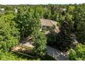 An exterior view of a home, surrounded by lush greenery at 5550 Preserve Dr, Greenwood Village, CO 80121