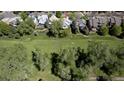Aerial view of a home's location near a beautiful golf course and walking path at 14186 E Hampden Pl, Aurora, CO 80014