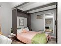 Comfortable bedroom with murphy bed, complemented by a modern decor and wood-look flooring at 100 S Clarkson St # 105, Denver, CO 80209