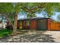Beautiful brick home with attached garage and well-kept lawn showcases modern curb appeal at 6088 Quail Ct, Arvada, CO 80004