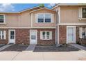 Charming brick townhouse featuring a well-maintained exterior and inviting entrance at 1534 S Ouray Cir # B, Aurora, CO 80017
