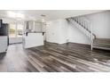 Open floor plan featuring sleek flooring, staircase, and plenty of natural light at 1534 S Ouray Cir # B, Aurora, CO 80017