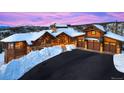 Mountain home with large windows and attached garage at 300 Little Sallie Barber Trl, Breckenridge, CO 80424