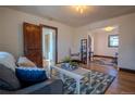 Light filled living room featuring hardwood floors, area rug and adjacent rooms at 437 Raleigh St, Denver, CO 80204