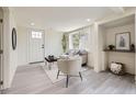 Bright living room with modern flooring, comfortable seating, and a large window offering natural light at 3275 S Decatur St, Denver, CO 80236