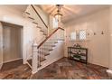 Elegant entryway showcasing a staircase, beautiful tile flooring, and stylish decor, setting a sophisticated tone at 537 N Logan St, Denver, CO 80203