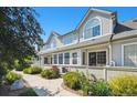 Inviting townhome exteriors with manicured gardens, sidewalks, and picturesque architectural details under a bright sky at 1124 E 130Th Ave # C, Thornton, CO 80241