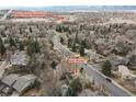 Aerial view showcasing a neighborhood with greenbelt access and tree-lined streets at 2492 S Yarrow St, Lakewood, CO 80227