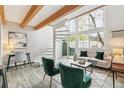 Sun-filled living room featuring a spiral staircase and large windows at 1842 Canyon Blvd # 209, Boulder, CO 80302